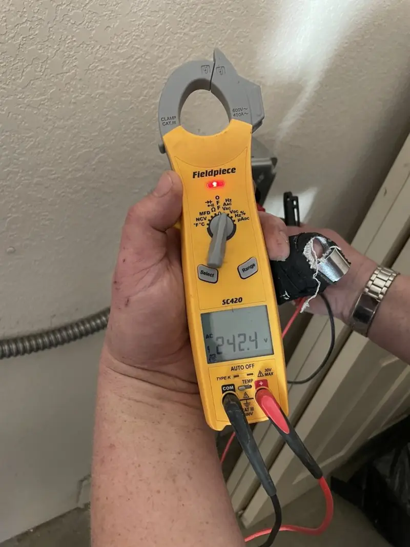 Voltage testing with clamp meter during Recessed Lighting Installation in Wixom